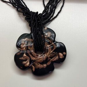 Elegant Black and Gold Floral Pendant Necklace